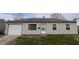 Simple, single story house with a front lawn and driveway leading to a single car garage at 3540 N Norfolk St, Indianapolis, IN 46224