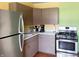 Well-equipped kitchen featuring stainless steel appliances, including a refrigerator and modern gas range at 3540 N Norfolk St, Indianapolis, IN 46224