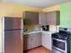 Modern kitchen with stainless steel appliances, including a refrigerator and a gas range at 3540 N Norfolk St, Indianapolis, IN 46224