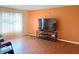 Bright living room with hardwood floors, complemented by ample natural light and an entertainment center at 3540 N Norfolk St, Indianapolis, IN 46224
