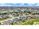 Expansive aerial view of a community with multiple ponds, lush greenery, and a variety of well-maintained homes at 3629 Pete Dye Blvd, Carmel, IN 46033