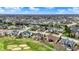 Wide aerial perspective of a community featuring ponds, verdant landscaping, and a mix of single-Gathering homes and golf courses at 3629 Pete Dye Blvd, Carmel, IN 46033
