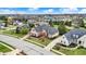 Stunning aerial view of an upscale neighborhood showcasing well-manicured lawns, mature trees, and picturesque homes at 3629 Pete Dye Blvd, Carmel, IN 46033
