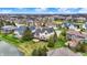 An aerial view capturing a neighborhood with luxurious homes and beautiful landscaping next to a lake at 3629 Pete Dye Blvd, Carmel, IN 46033