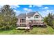 A spacious backyard features a patio and deck, perfect for outdoor entertaining with beautiful landscaping at 3629 Pete Dye Blvd, Carmel, IN 46033