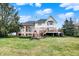 Large backyard with lush green grass, mature trees, and a basketball hoop at 3629 Pete Dye Blvd, Carmel, IN 46033