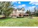 Spacious backyard featuring a wooden deck, lush lawn, and mature trees, ideal for outdoor entertaining at 3629 Pete Dye Blvd, Carmel, IN 46033