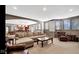 Finished basement with tan sectional, leather chairs, and recessed lighting at 3629 Pete Dye Blvd, Carmel, IN 46033