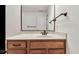 Bathroom vanity with white countertop and bronze fixtures at 3629 Pete Dye Blvd, Carmel, IN 46033