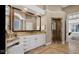 Spacious bathroom featuring a double vanity, a glass enclosed shower, and a soaking tub at 3629 Pete Dye Blvd, Carmel, IN 46033