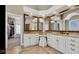 Bathroom with double sinks, granite counters, decorative mirrors, tile floor and walk-in closet at 3629 Pete Dye Blvd, Carmel, IN 46033