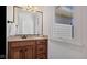 Bathroom vanity with tan countertop and bronze fixtures at 3629 Pete Dye Blvd, Carmel, IN 46033