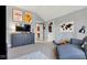 This bedroom is adorned with sports memorabilia, a comfy couch, and a nice dresser at 3629 Pete Dye Blvd, Carmel, IN 46033
