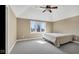 This minimalist bedroom offers a light, airy feel with its neutral color palette and large window at 3629 Pete Dye Blvd, Carmel, IN 46033