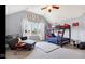 This bedroom has a fun bunkbed, GOAT decor, and a cozy lounge chair at 3629 Pete Dye Blvd, Carmel, IN 46033