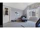 This bedroom includes decor, a relaxing couch, and a large window at 3629 Pete Dye Blvd, Carmel, IN 46033