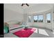 Bright bedroom with daybed, bay window, and pink rug at 3629 Pete Dye Blvd, Carmel, IN 46033