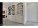 Spacious white built-in shelving unit with cabinets and display space for books and decorations at 3629 Pete Dye Blvd, Carmel, IN 46033