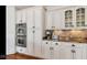 Bright kitchen with stainless steel appliances, custom cabinetry, and stylish granite countertops at 3629 Pete Dye Blvd, Carmel, IN 46033