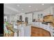 Spacious kitchen featuring granite countertops, a large island, and modern stainless steel appliances at 3629 Pete Dye Blvd, Carmel, IN 46033
