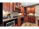 Features cherry cabinets with granite countertops and tiled backsplash, plus modern appliances at 3629 Pete Dye Blvd, Carmel, IN 46033