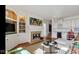 Elegant living room with a fireplace, built-in shelving, and hardwood floors, creating a cozy and inviting atmosphere at 3629 Pete Dye Blvd, Carmel, IN 46033