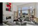 Bright living room with a decorative fireplace, large windows, and comfortable seating arrangements at 3629 Pete Dye Blvd, Carmel, IN 46033