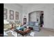 Cozy living room featuring traditional furnishings, artwork, and a bright, airy atmosphere at 3629 Pete Dye Blvd, Carmel, IN 46033