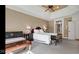 Inviting main bedroom with a cozy bed, neutral walls, and a ceiling fan for comfort at 3629 Pete Dye Blvd, Carmel, IN 46033