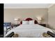 Elegantly furnished main bedroom with a luxurious bed, lamps, and stylish decor at 3629 Pete Dye Blvd, Carmel, IN 46033