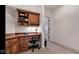 Cozy office area with wood desk, overhead storage, and neutral carpet at 3629 Pete Dye Blvd, Carmel, IN 46033