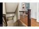 Staircase with hardwood stairs and iron railing at 3629 Pete Dye Blvd, Carmel, IN 46033