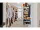 Large walk-in closet with custom shelving and hanging racks for optimal organization at 3629 Pete Dye Blvd, Carmel, IN 46033