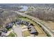 Overhead view of a quiet suburban neighborhood with homes surrounding a central lake and lush greenery at 368 Westbrook Ct, Columbus, IN 47201