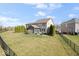 Large backyard with a fence, screened-in porch, and well-maintained lawn at 368 Westbrook Ct, Columbus, IN 47201