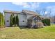 Spacious backyard showing the screened in porch and pool area surrounded by trees at 368 Westbrook Ct, Columbus, IN 47201