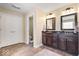 Well-lit bathroom with double sink vanity, tiled floors and convenient layout at 368 Westbrook Ct, Columbus, IN 47201