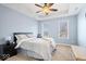 Cozy bedroom with tray ceiling, ceiling fan, and ample natural light at 368 Westbrook Ct, Columbus, IN 47201