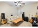 Bonus room is setup for a music room with amps and guitars at 368 Westbrook Ct, Columbus, IN 47201