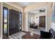 Inviting foyer with hardwood floors leading to a cozy living space, complete with a ceiling fan at 368 Westbrook Ct, Columbus, IN 47201