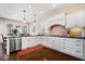 Bright kitchen with white cabinets, granite countertops, stainless steel appliances, and stylish pendant lighting at 368 Westbrook Ct, Columbus, IN 47201