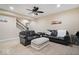 Finished basement living area features leather furniture, neutral carpet and modern decor at 368 Westbrook Ct, Columbus, IN 47201