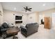 Cozy living room with leather furniture, ceiling fan and accent lighting at 368 Westbrook Ct, Columbus, IN 47201
