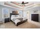 Spacious main bedroom featuring a decorative tray ceiling and ensuite bathroom at 368 Westbrook Ct, Columbus, IN 47201