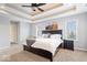 Spacious main bedroom featuring a decorative tray ceiling, and ensuite bathroom at 368 Westbrook Ct, Columbus, IN 47201