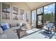 Cozy sunroom with comfortable seating and outdoor access to a backyard patio at 368 Westbrook Ct, Columbus, IN 47201