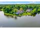 Lakeside home with a backyard deck offers stunning water views and a private outdoor retreat at 3862 Penzance Pl, Carmel, IN 46032