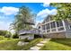 A backyard view reveals a beautiful deck, sunroom, and well-manicured lawn, enhancing the home's appeal at 3862 Penzance Pl, Carmel, IN 46032