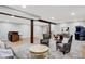 Finished basement features a bar, game tables, lounge, and arcade games at 3862 Penzance Pl, Carmel, IN 46032