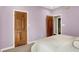 Bedroom with wooden doors, neutral carpet, and walls offering a blank canvas for personalization at 3862 Penzance Pl, Carmel, IN 46032